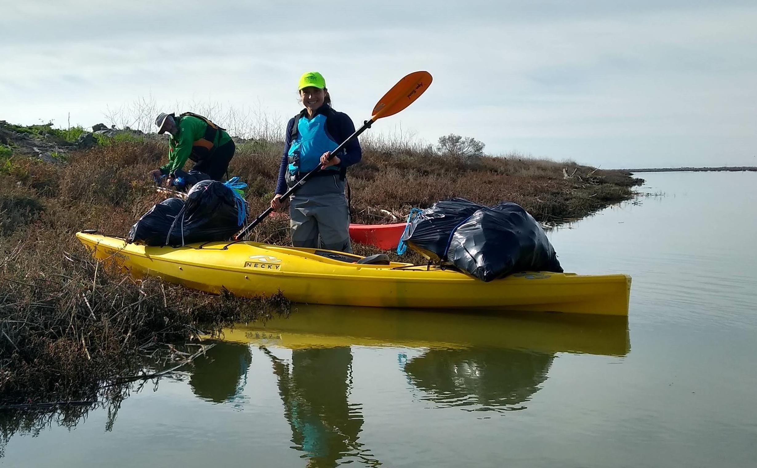 Eric Larkin, Kate Freeman, trash bags, and kayak