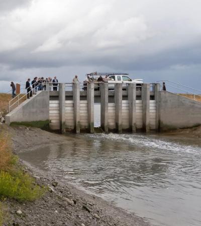 For the first time in decades, the waters of Pond A8 and the San Francisco Bay comingled as the first dam gate was opened. Credit: Judy Irving, Pelican Media.