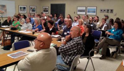 Stakeholders participate at a Forum meeting.
