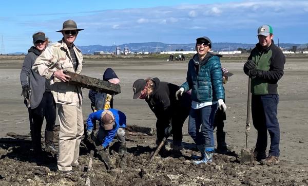 Volunteers make nesting habitat for snowy plovers. Credit: Laura Cholodenko