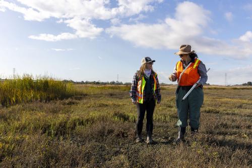 Christina Toms of the RWQCB and Aviva Ross of WRMP at Pinole wetlands. Credit Tam Vu, KQED