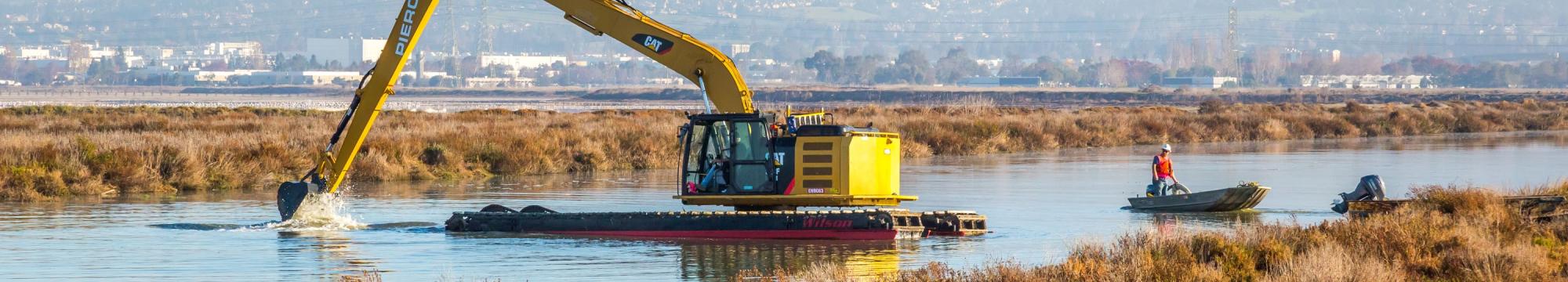 Construction crews digging open Island Pond A19. Credit: Julie Kitzenberger