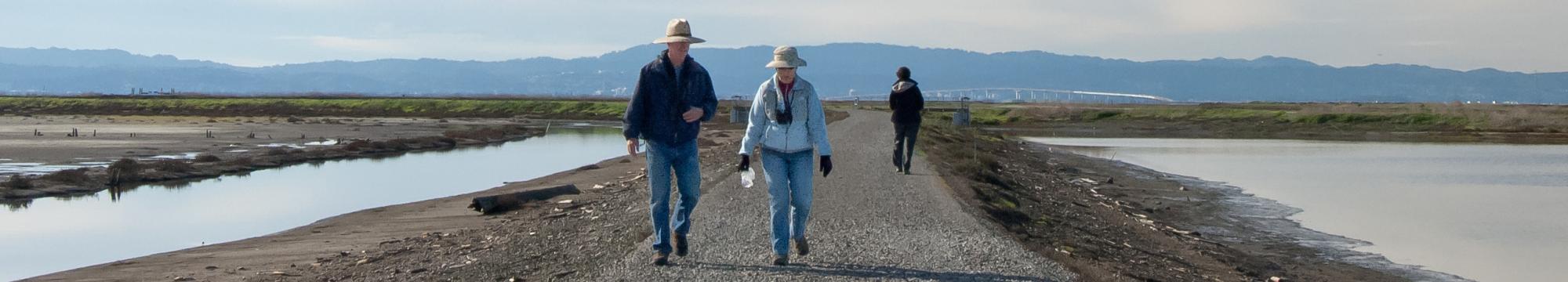 Hikers at Eden Landing Ecological Reserve. Photo by Judy Irving, Pelican Media.