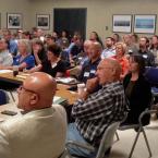 Stakeholders participate at a Forum meeting.