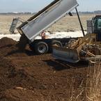 Dirt is delivered and smoothed at Ravenswood Pond R4, which will become salt marsh with an upland habitat bordering Menlo Park's Bedwell Bayfront Park.