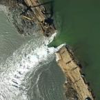 Bay waters pour through the breached Ravenswood levee. Drone video image by Jack Morris.