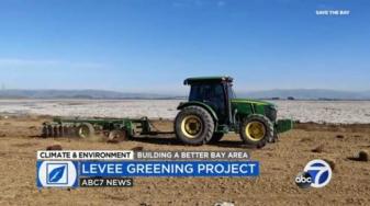 A Save The Bay tractor prepares the ground for planting at Ravenswood Ponds