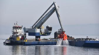 Dredged sediments are loaded on a scow bound for Eden Landing. Credit: U.S. Army Corps of Engineers