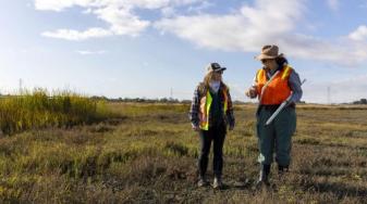 Christina Toms of the RWQCB and Aviva Ross of WRMP at Pinole wetlands. Credit Tam Vu, KQED
